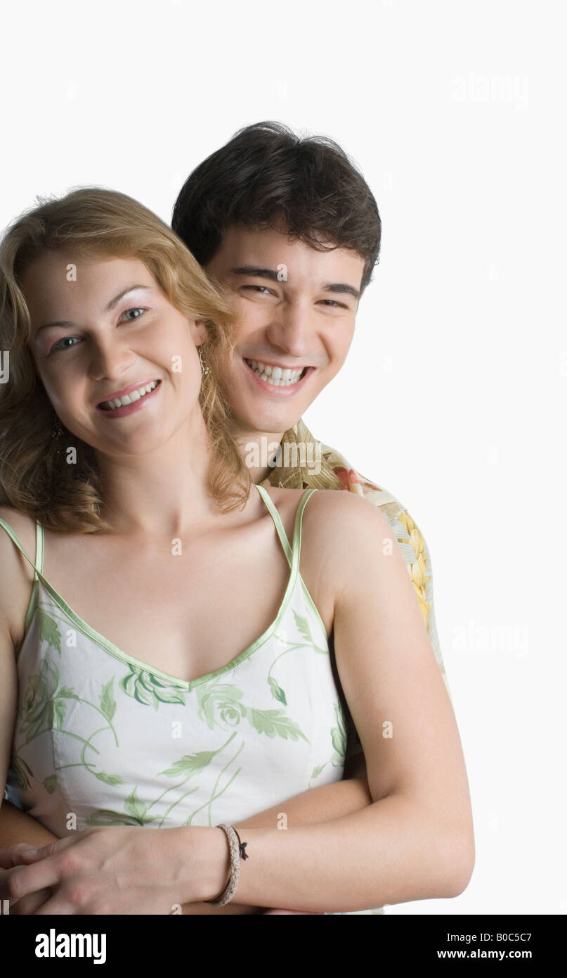 Portrait of a young couple smiling Stock Photo - Alamy