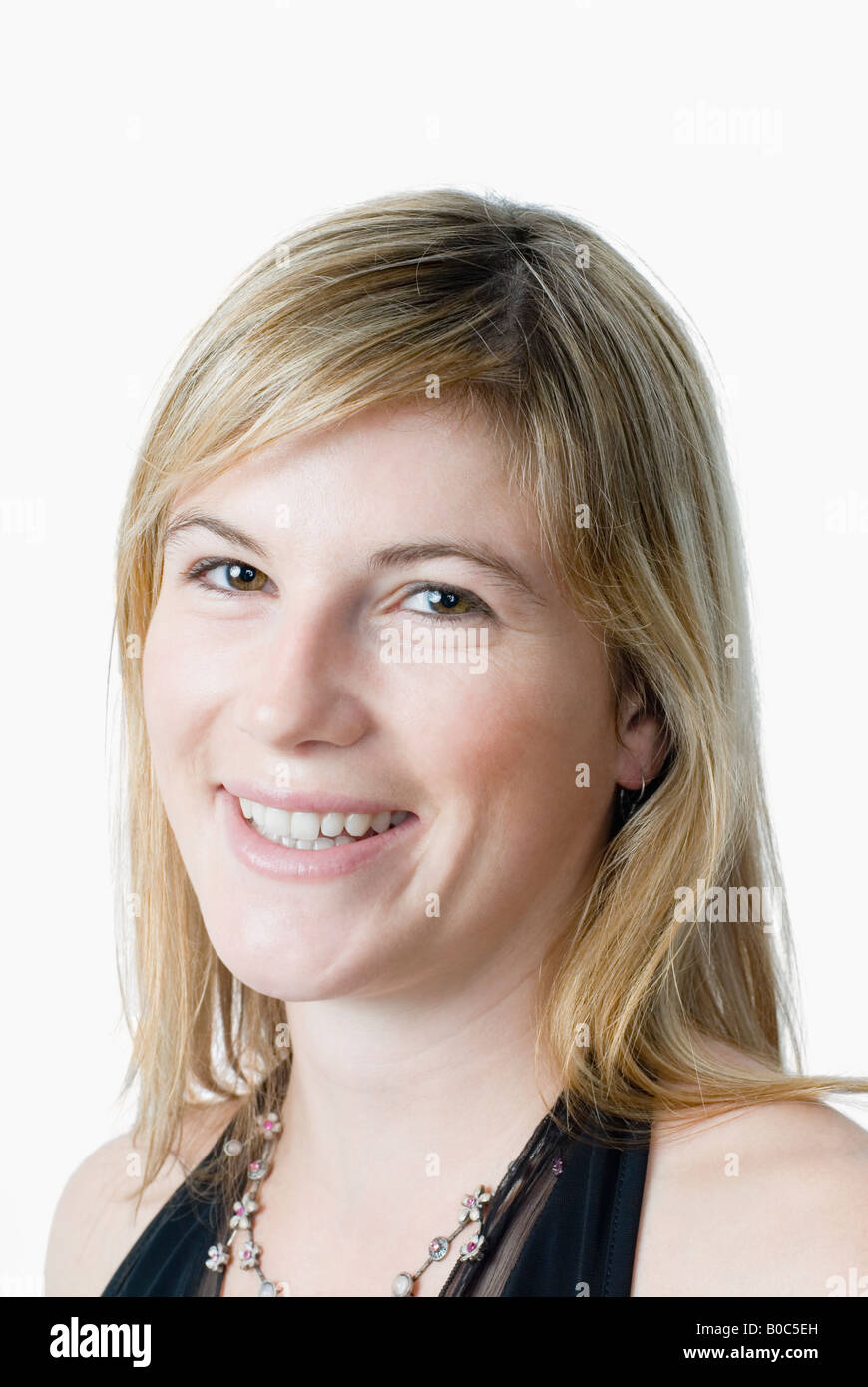 Portrait of a young woman smiling Stock Photo - Alamy