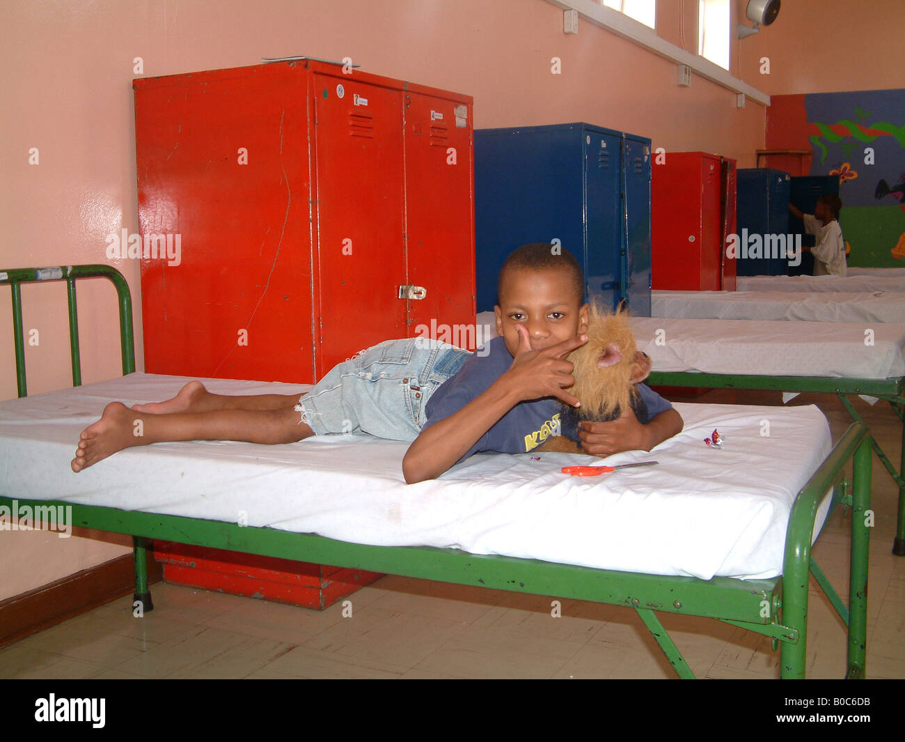 A disabled boy, in his bed in the Helen Bishop Home. Stock Photo
