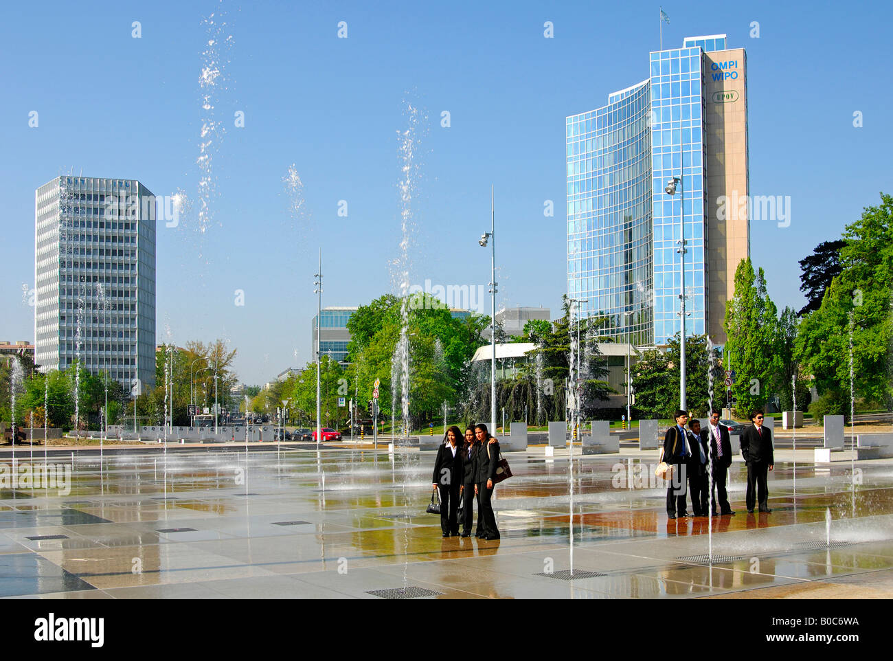 Trick fountains on Place des Nations in Geneva, ITU Headquarters left, WIPO UPOV buildings on the right, Geneva Switzerland Stock Photo