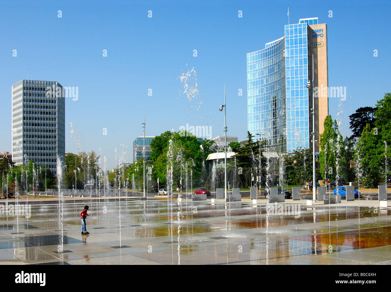 Trick fountains on Place des Nations in Geneva, ITU Headquarters left, WIPO UPOV buildings on the right, Geneva Switzerland Stock Photo