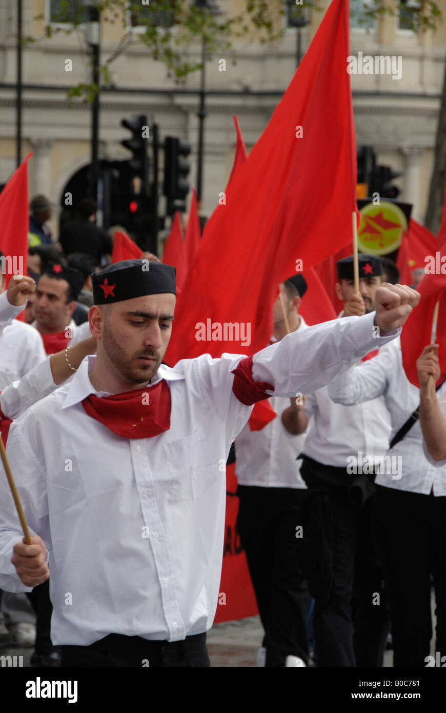 Communist marchers with red flags at the 2008 May Day parade in Trafalgar Square London Stock Photo