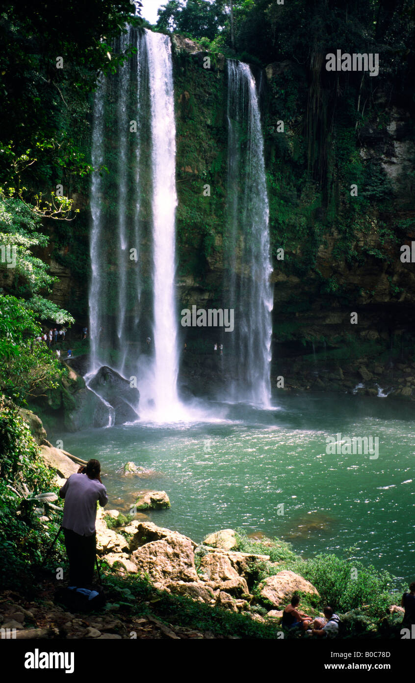 Photographer taking a picture of Misol-Ha waterfall on the way to Agua Azul from Palenque in Mexican Chiapas. Stock Photo