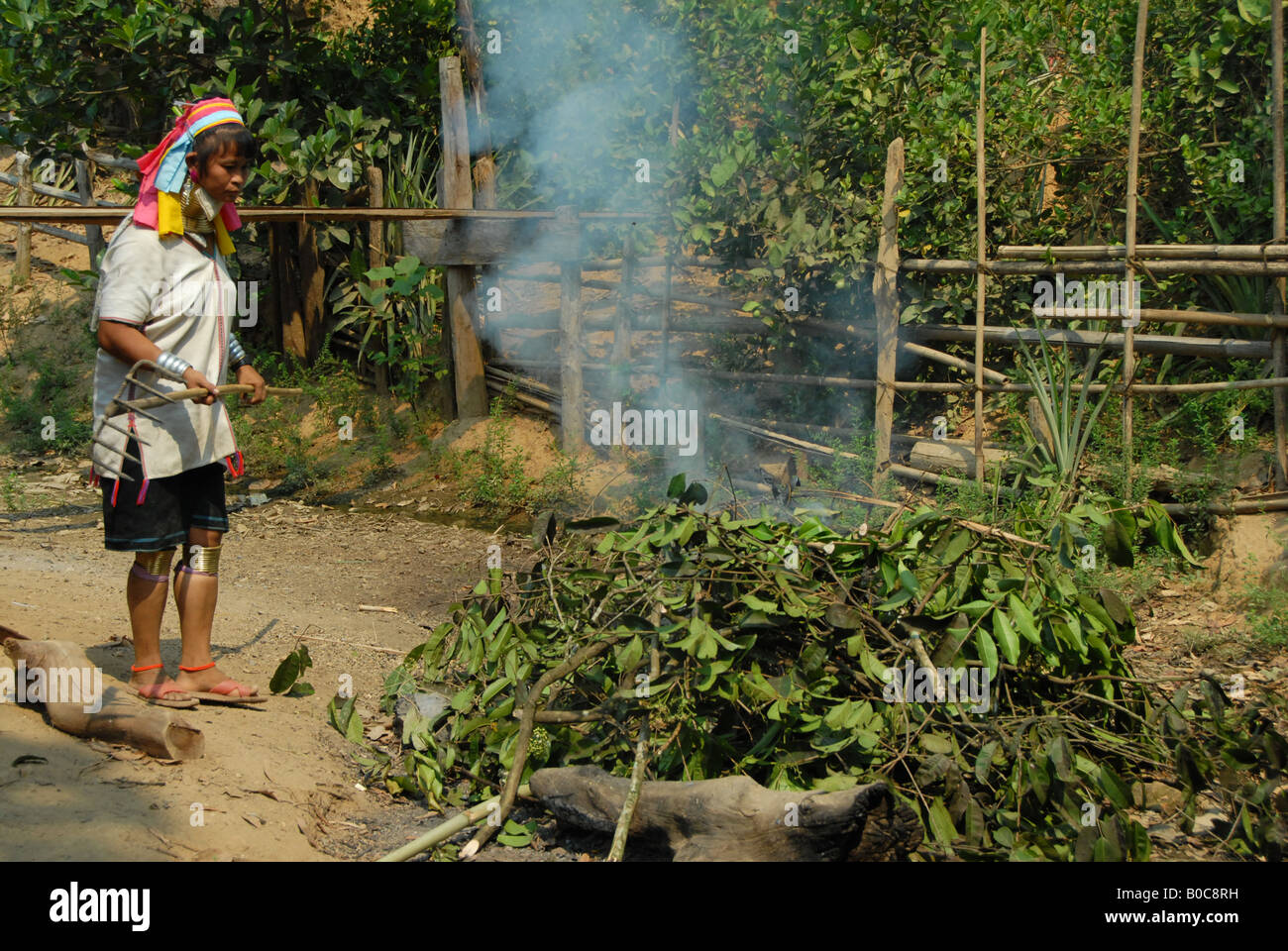 longneck karen woman  burning leaves, mae hong son , thailand Stock Photo