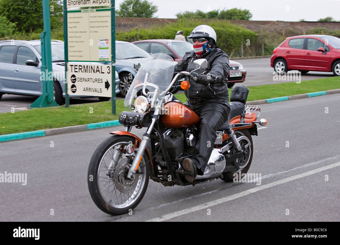 Harley Davidson bike rider at Shoreham Airport Sussex England Stock Photo