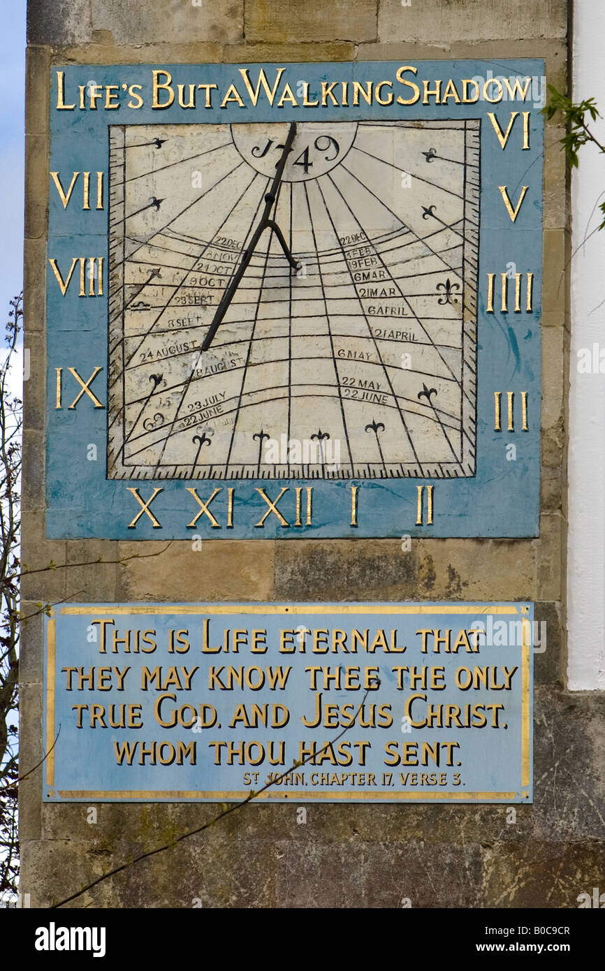 Life is but a Walking Shadow sun dial and plaque in the Salisbury Cathedral Close on the wall of Malmesbury House Stock Photo