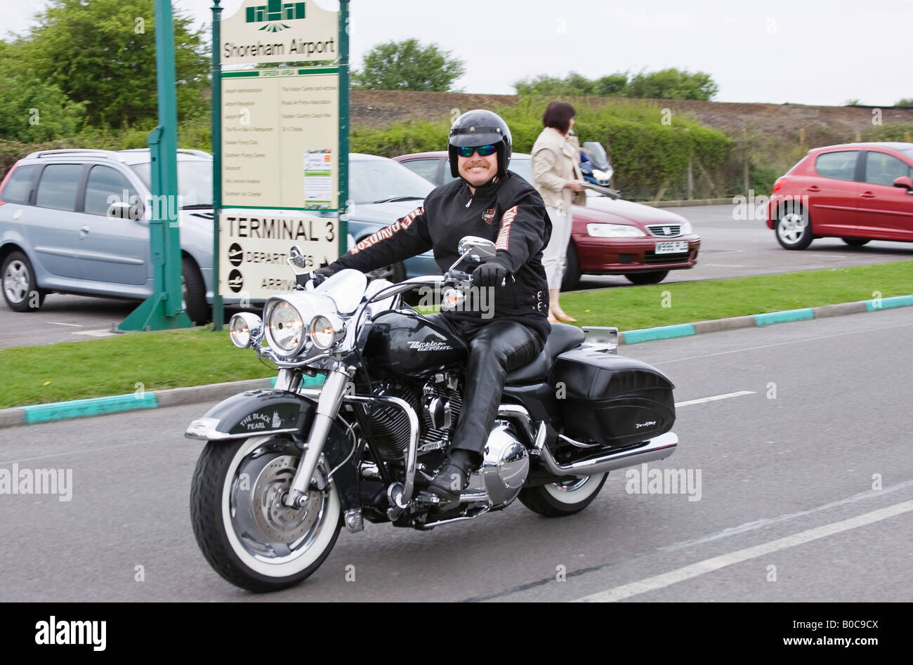 Harley Davidson bike rider at Shoreham Airport Sussex England Stock Photo