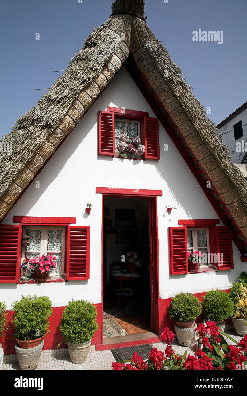 A-framed house or Palheiros are traditional Madeiran homes found in the town of Santana. Stock Photo