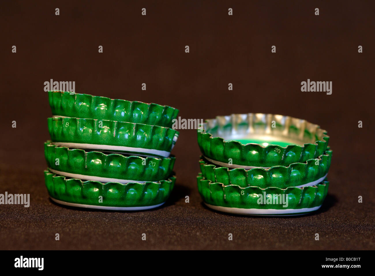 green beer bottle caps stacked close up Stock Photo Alamy