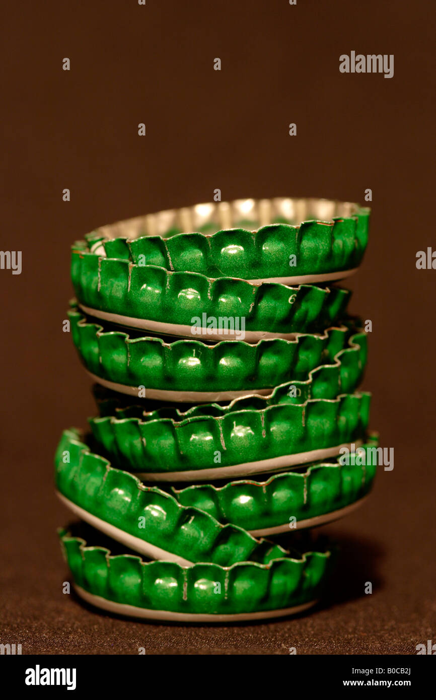 green beer bottle caps stacked close up Stock Photo Alamy