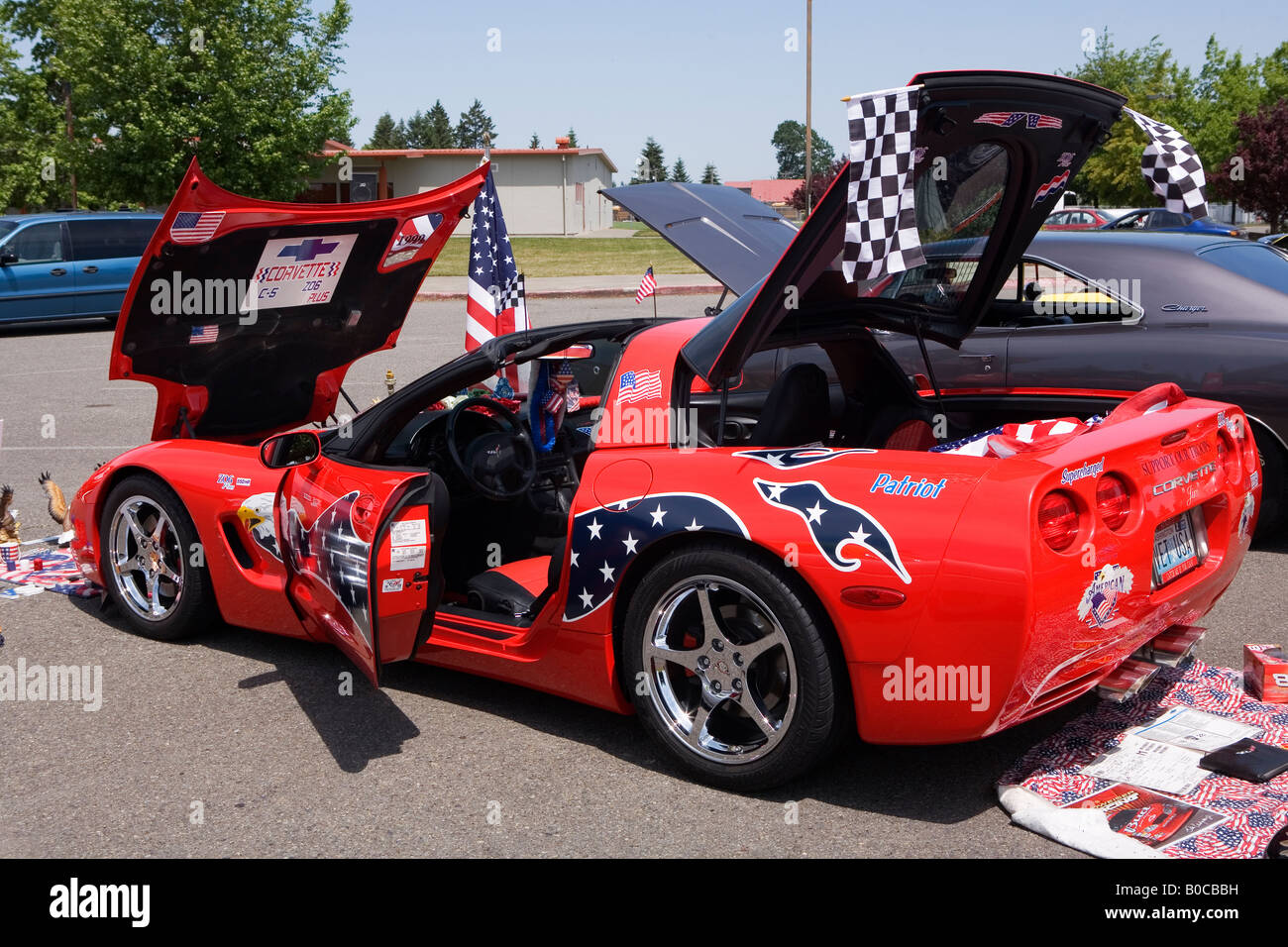 Image of a 1999 red Corvette all decorated with American Flags Stock Photo