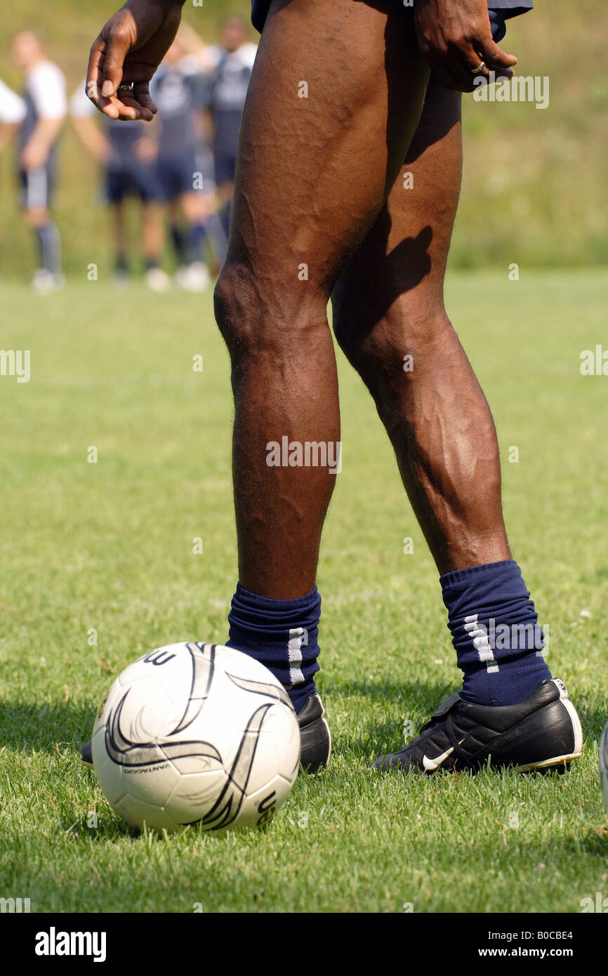 Legs of a football player during training Stock Photo - Alamy