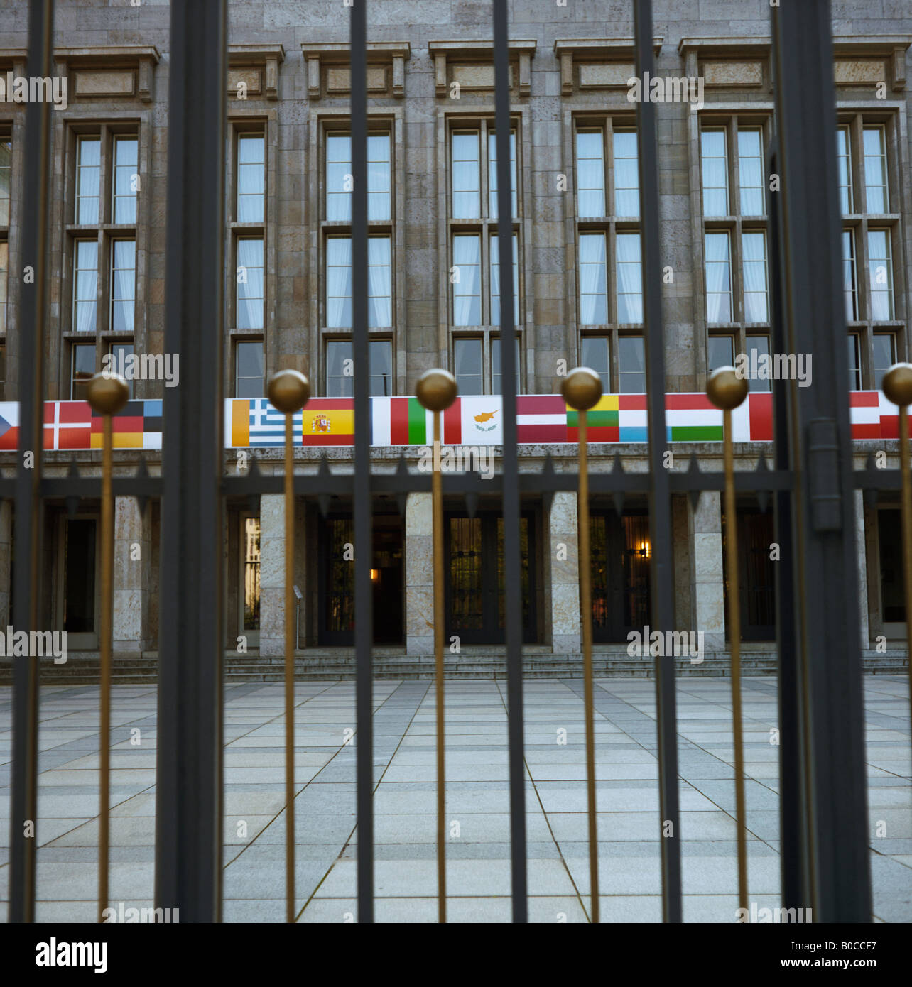 Germany, Berlin, Government building with flags seen from gates Stock Photo