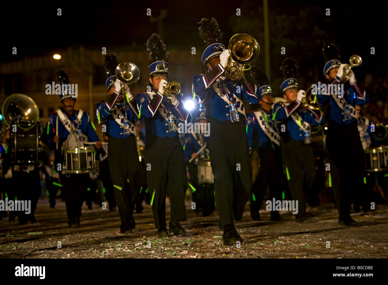 Band marching at night. High School Bulldogs brass band in uniform. San Antonio Texas Fiesta