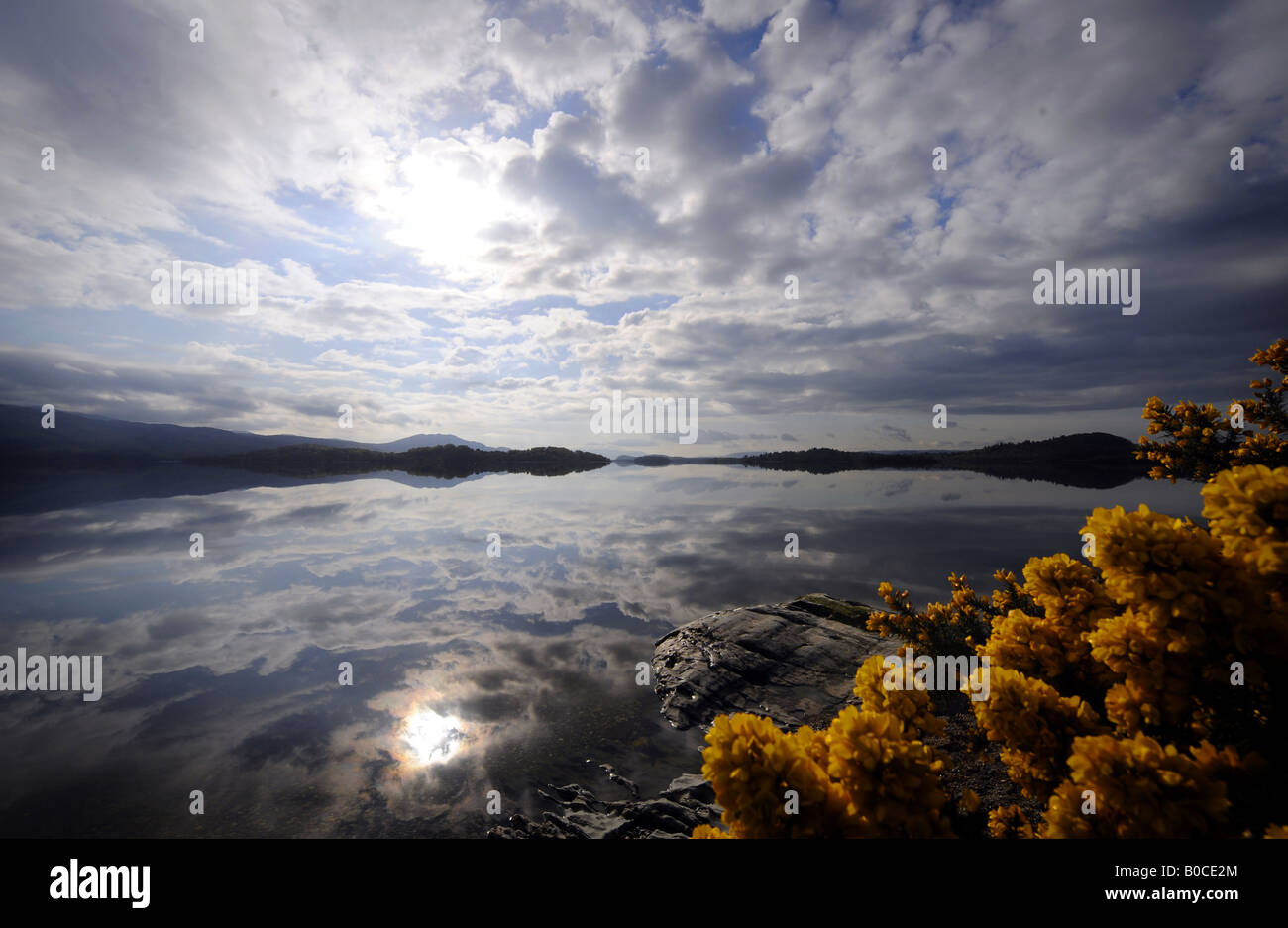 A EARLY MORNING  WITH DRAMATIC SKY VIEW ACROSS LOCH LOMOND IN SCOTLAND.UK Stock Photo