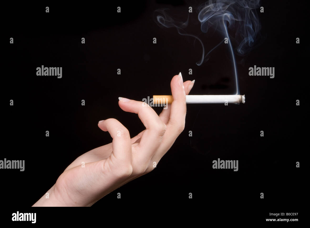 Elegant hand of a woman holding a cigarette Stock Photo Alamy