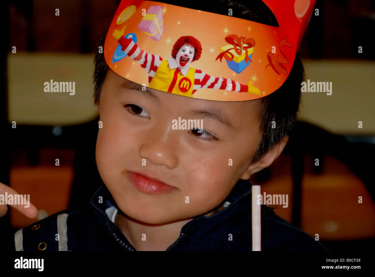 chinese boy in the Mcdonald's have birthday. Stock Photo