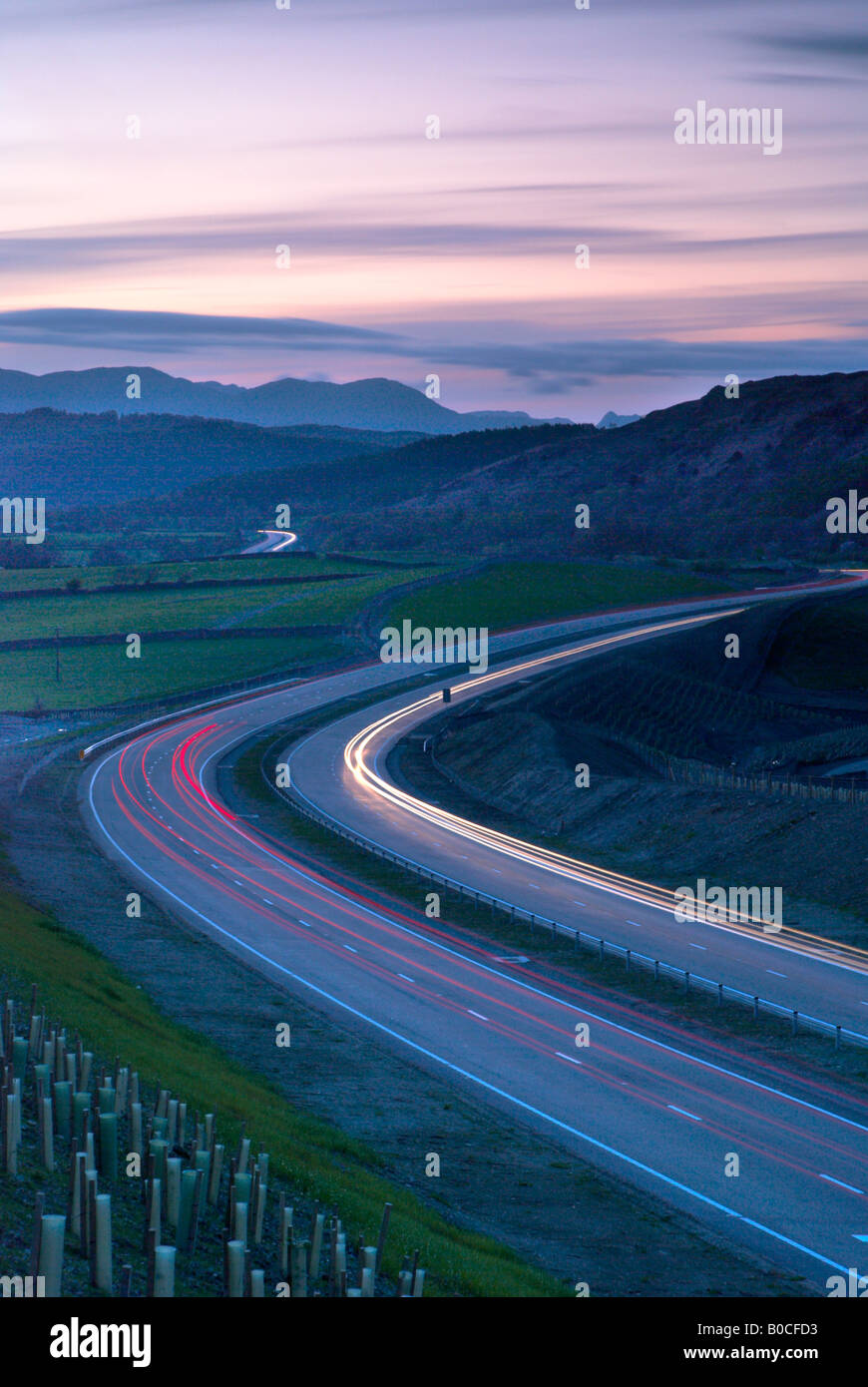 Road through the landscape at dusk The A590 High Newton By Pass on the