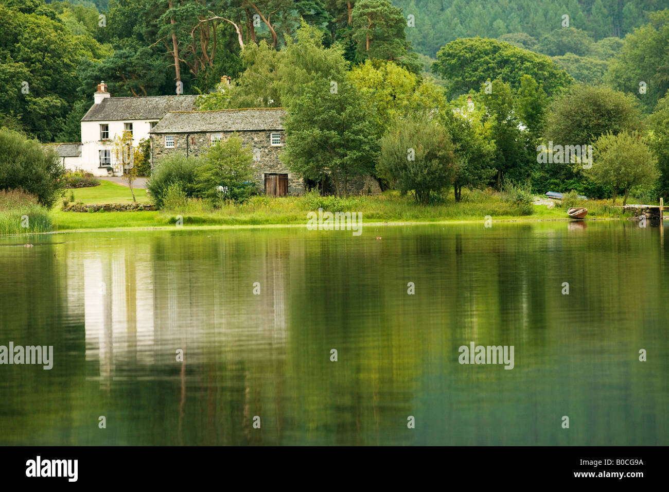 Derwent Water Lakeland Farm Cottages Reflected On The Lakes Waters