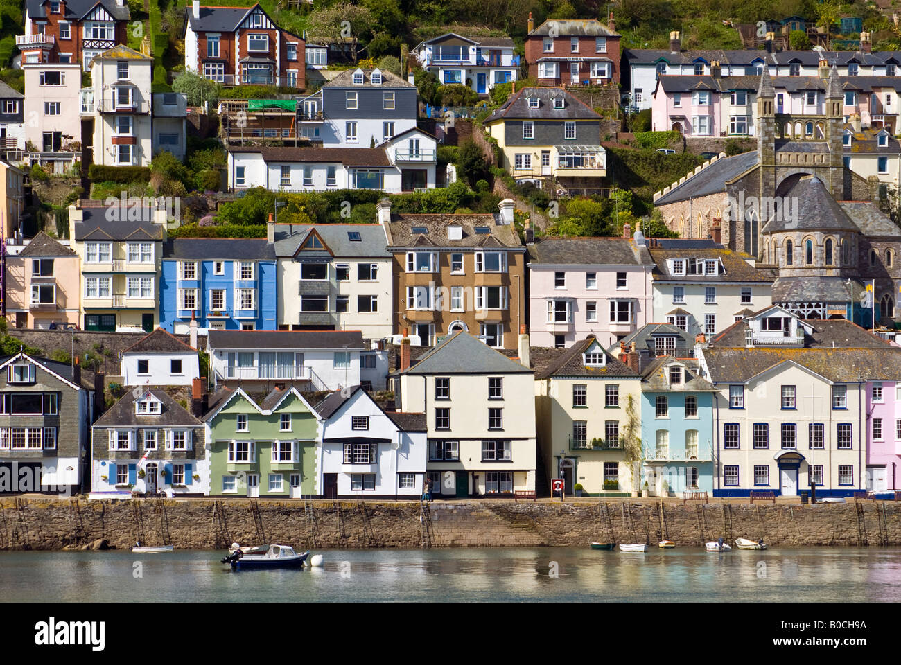 Houses line the hillside above the harbour in Dartmouth, Devon, England