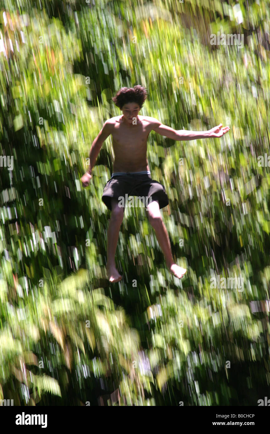 Man Jump Fall Young man jumping down waterfall Stock Photo - Alamy