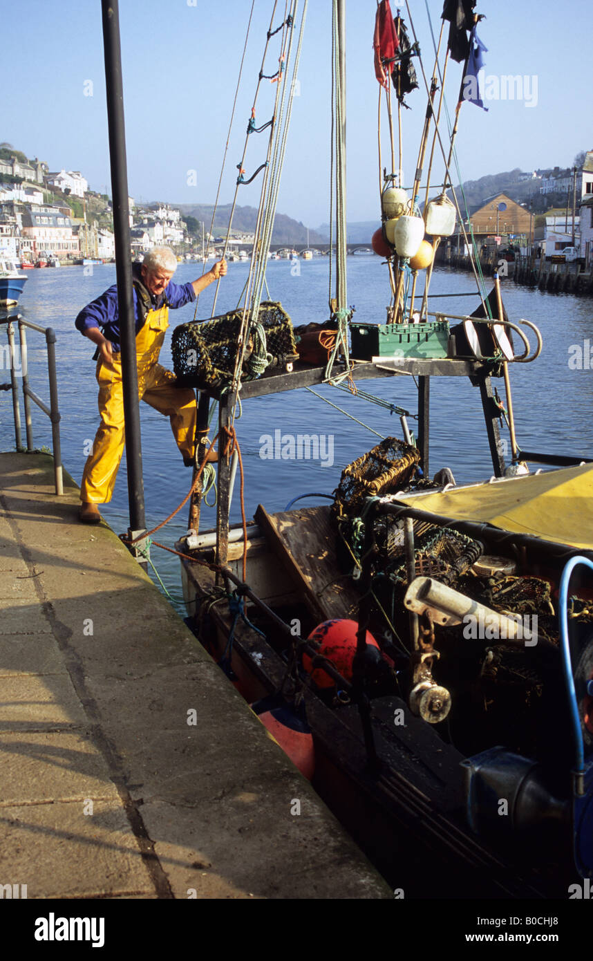 Lobster Fisherman With Fishing Boat In Looe Cornwall Stock Photo