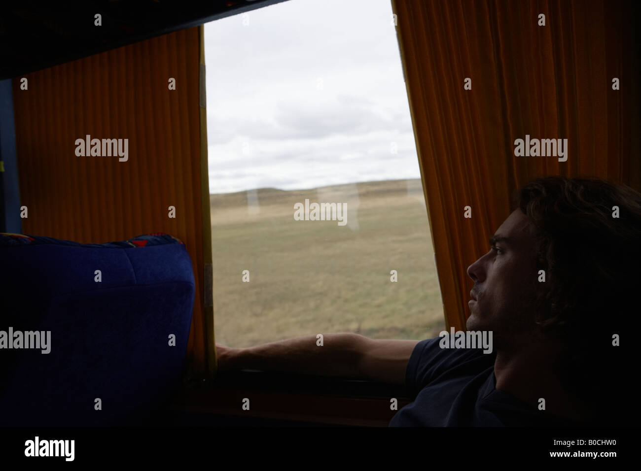 Coach with passenger and view out of window in Patagonia South America ...