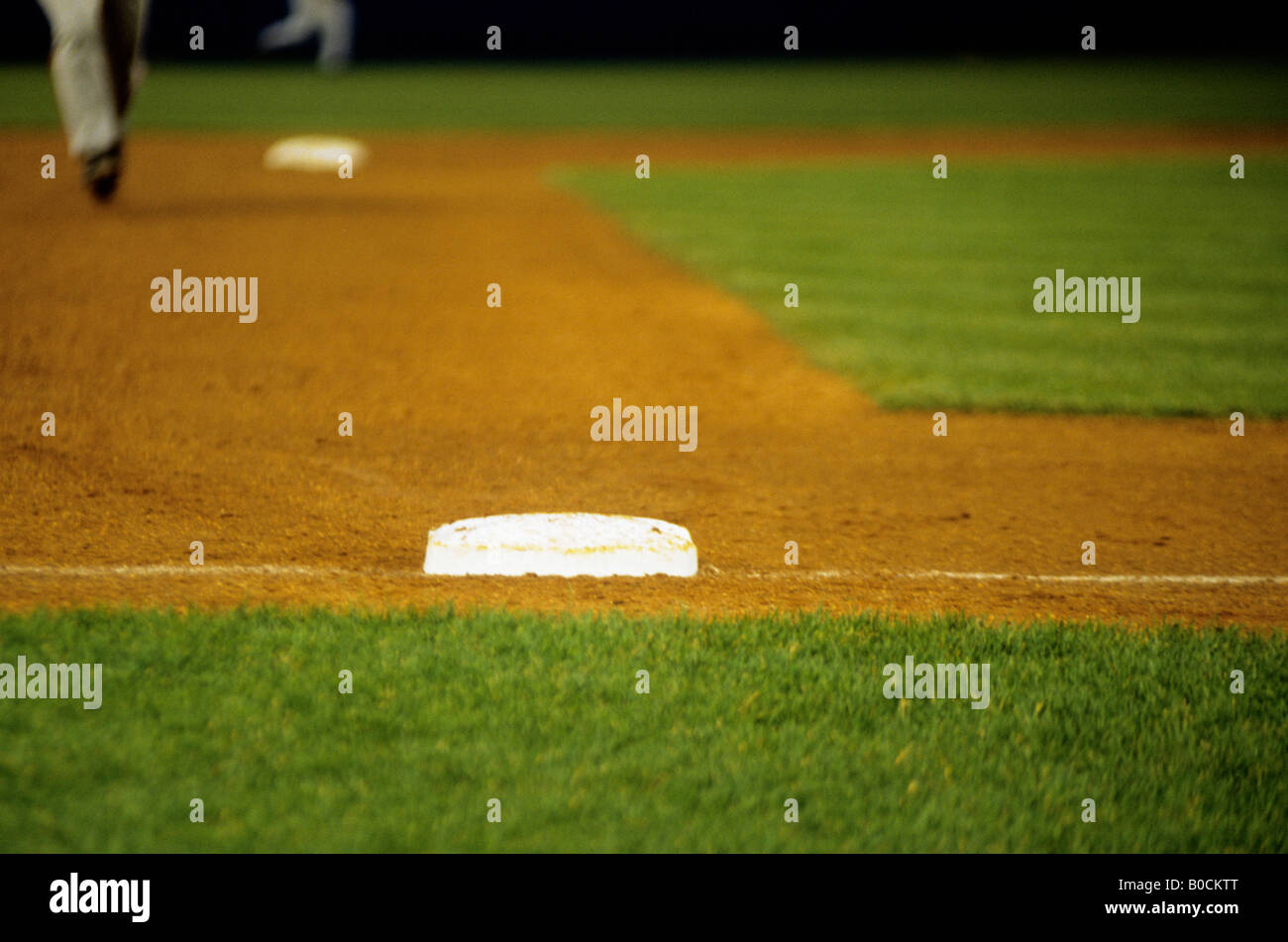 Base and Runner on Baseball Field Stock Photo