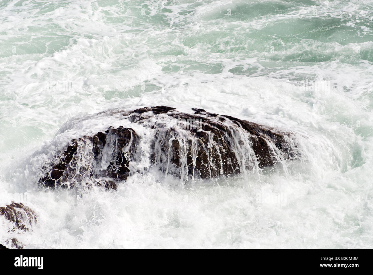 Waves crash on the rocks on the South Devon Coast, England Stock Photo