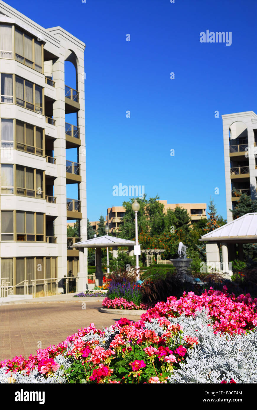 View of modern upscale condominium buildings with landscaping Stock Photo