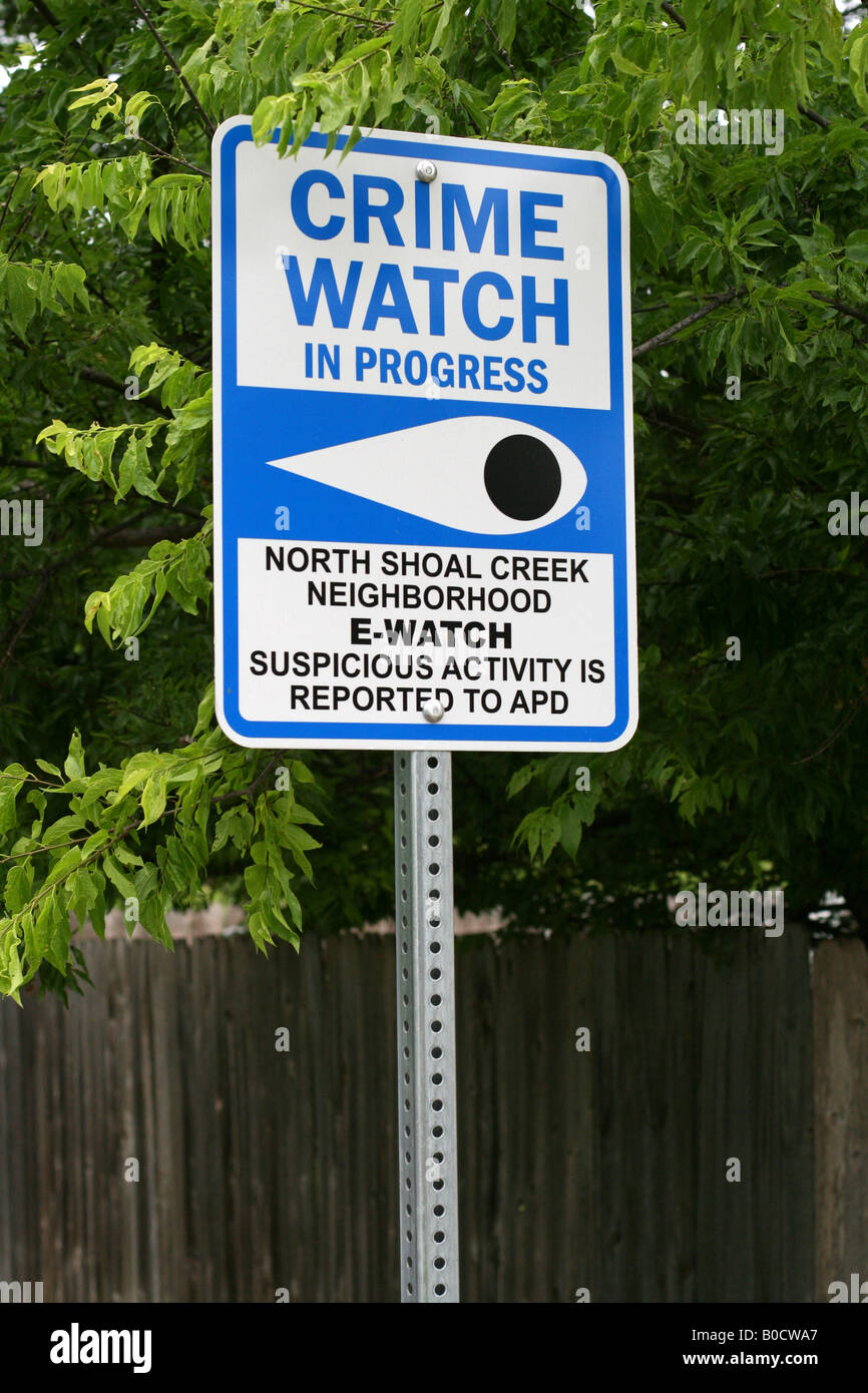 Neighborhood watch sign reads Crime watch in progress Stock Photo