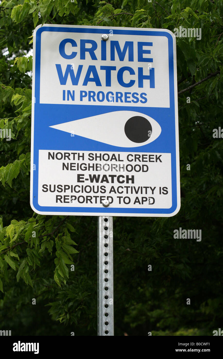 Neighborhood watch sign reads Crime watch in progress Stock Photo