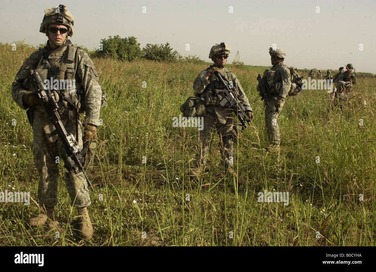 U S Army soldiers conduct a foot patrol in Yusufiyah Iraq to locate three missing soldiers on May 20 2007 Stock Photo