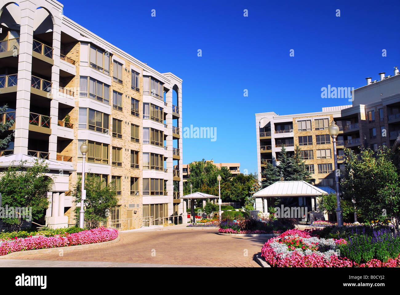 View of modern upscale condominium buildings with landscaping Stock Photo