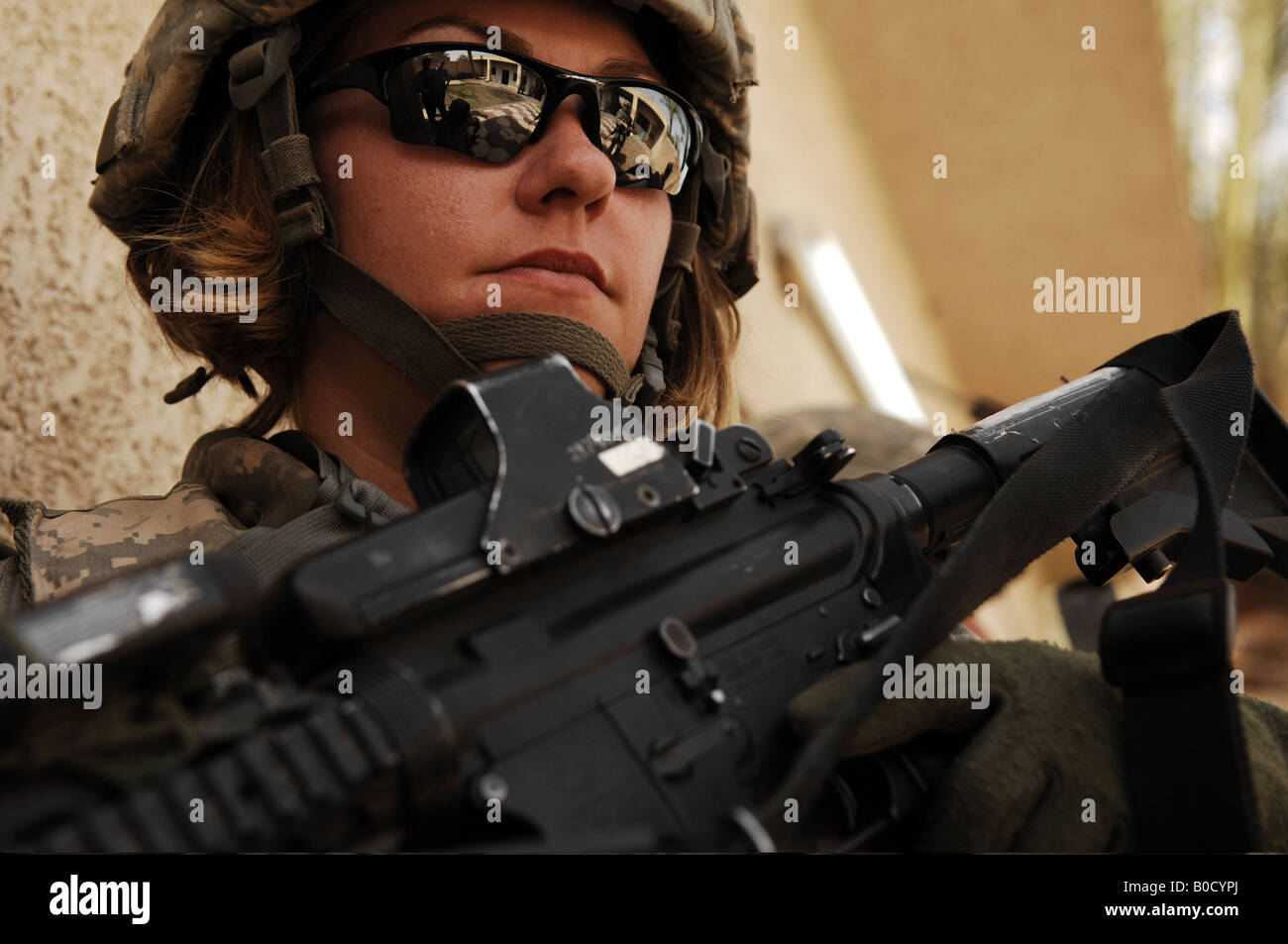 U S Army Spc Rebecca Buck provides perimeter security outside an Iraqi police station in the Tarmiya Province of Iraq. Stock Photo