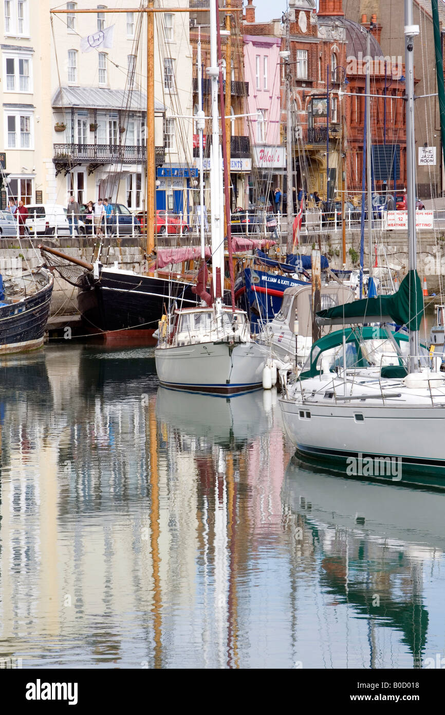 Boats and yachts moored in Ramsgate Harbour marina with historical