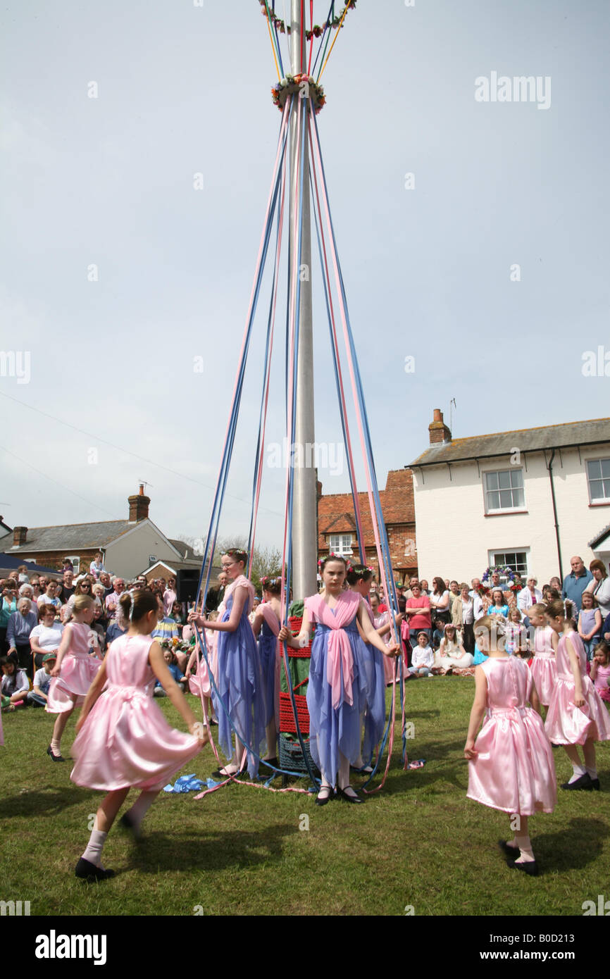 Children dancing around the Maypole at The Downton Cuckoo Fair Stock