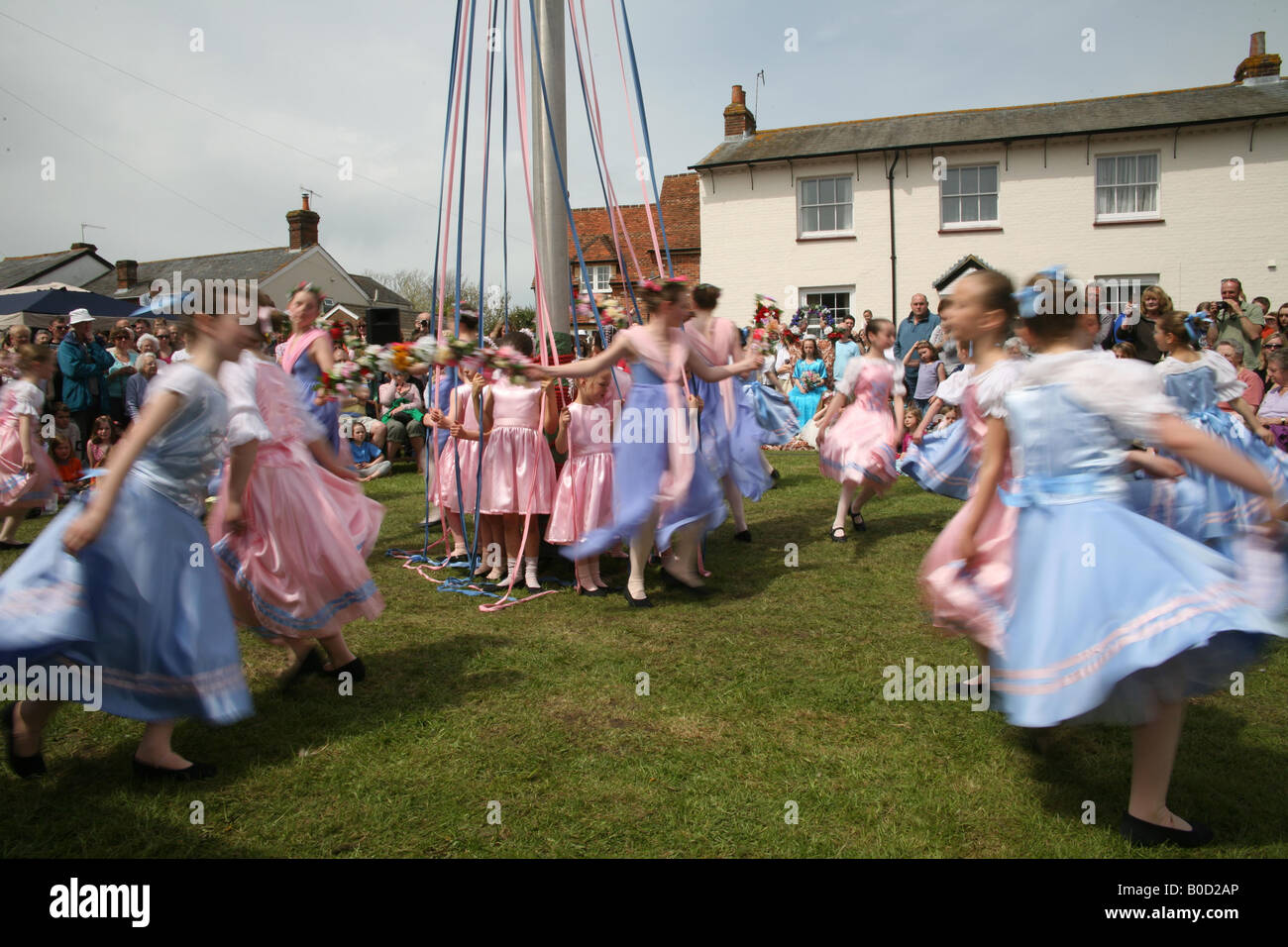 Children dancing around the Maypole at The Downton Cuckoo Fair Stock