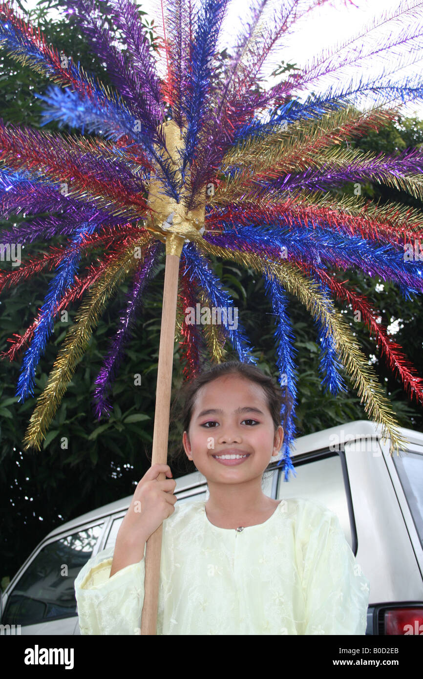 Malay Girl Holding Bunga Mangga Paper Strips On Pole Stock Photo Alamy