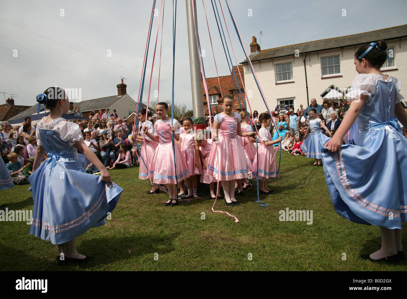 Children dancing around the Maypole at The Downton Cuckoo Fair Stock