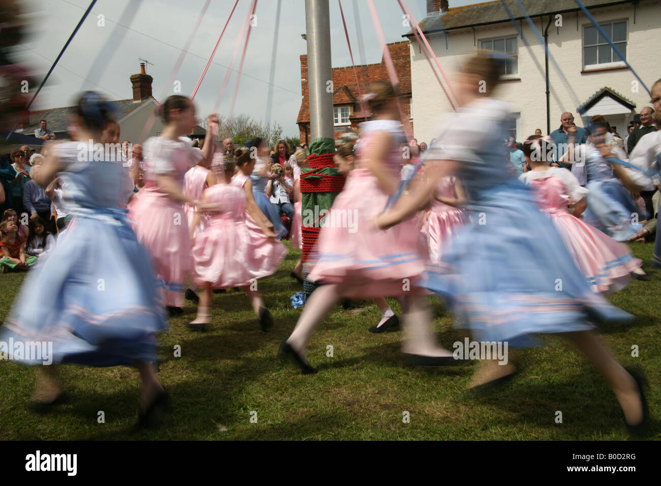 Children dancing around the Maypole at The Downton Cuckoo Fair Stock