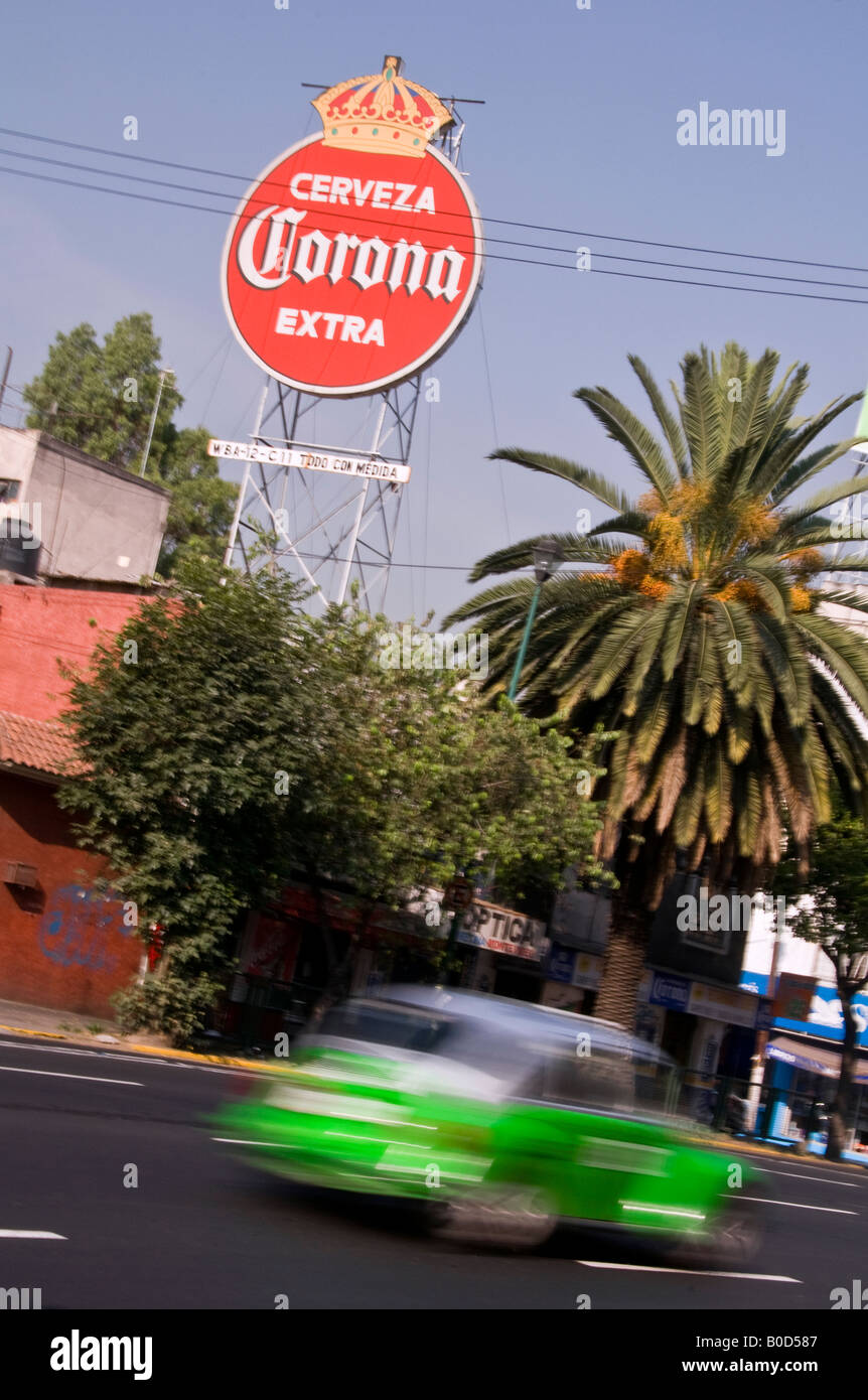 Iconic green VW Beetle used as a taxi in Mexico City. The Corona sign in the background is for Spanish beer. Stock Photo