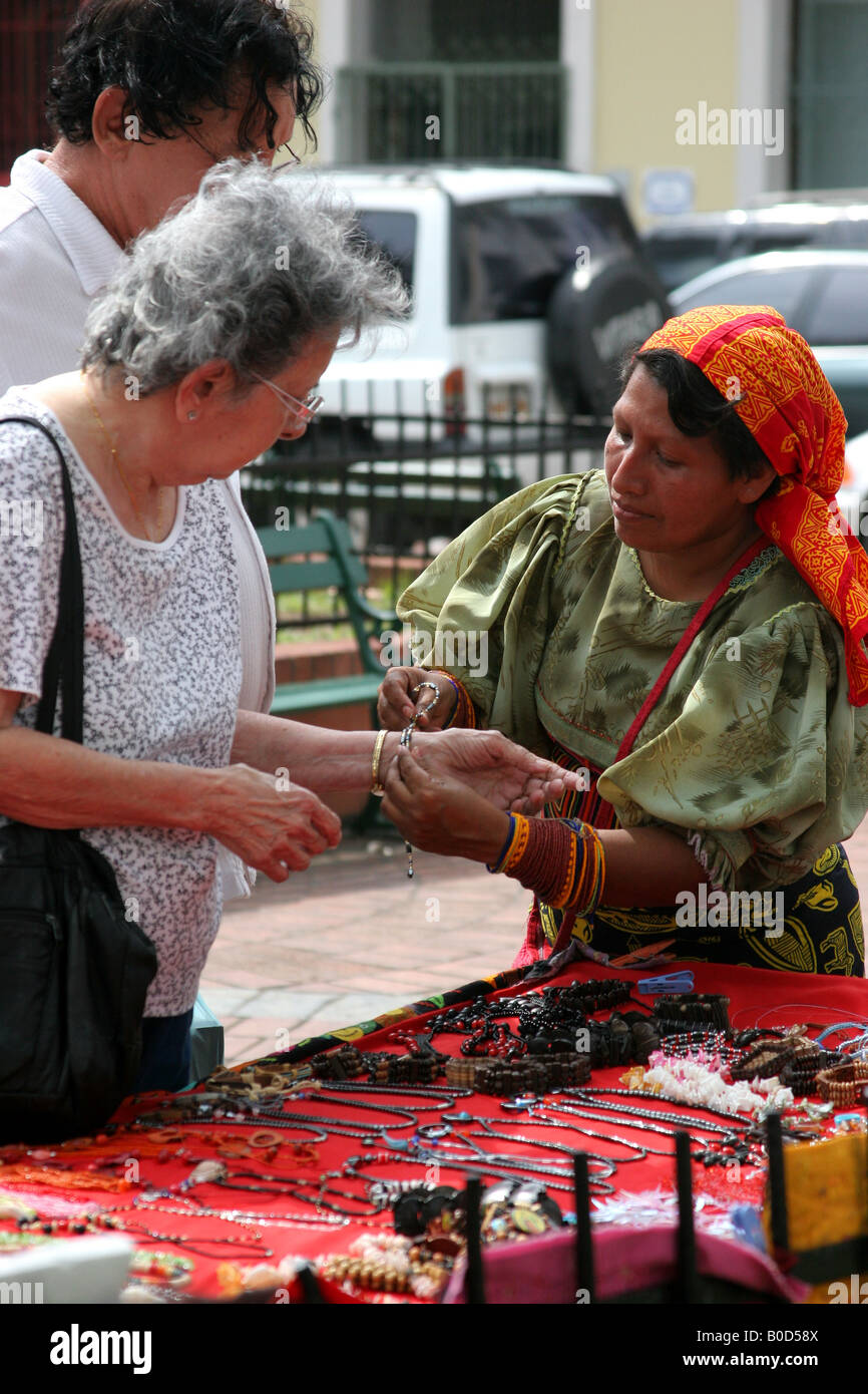 Kuna indian woman selling chaquiras at a street market of Panama City Stock Photo
