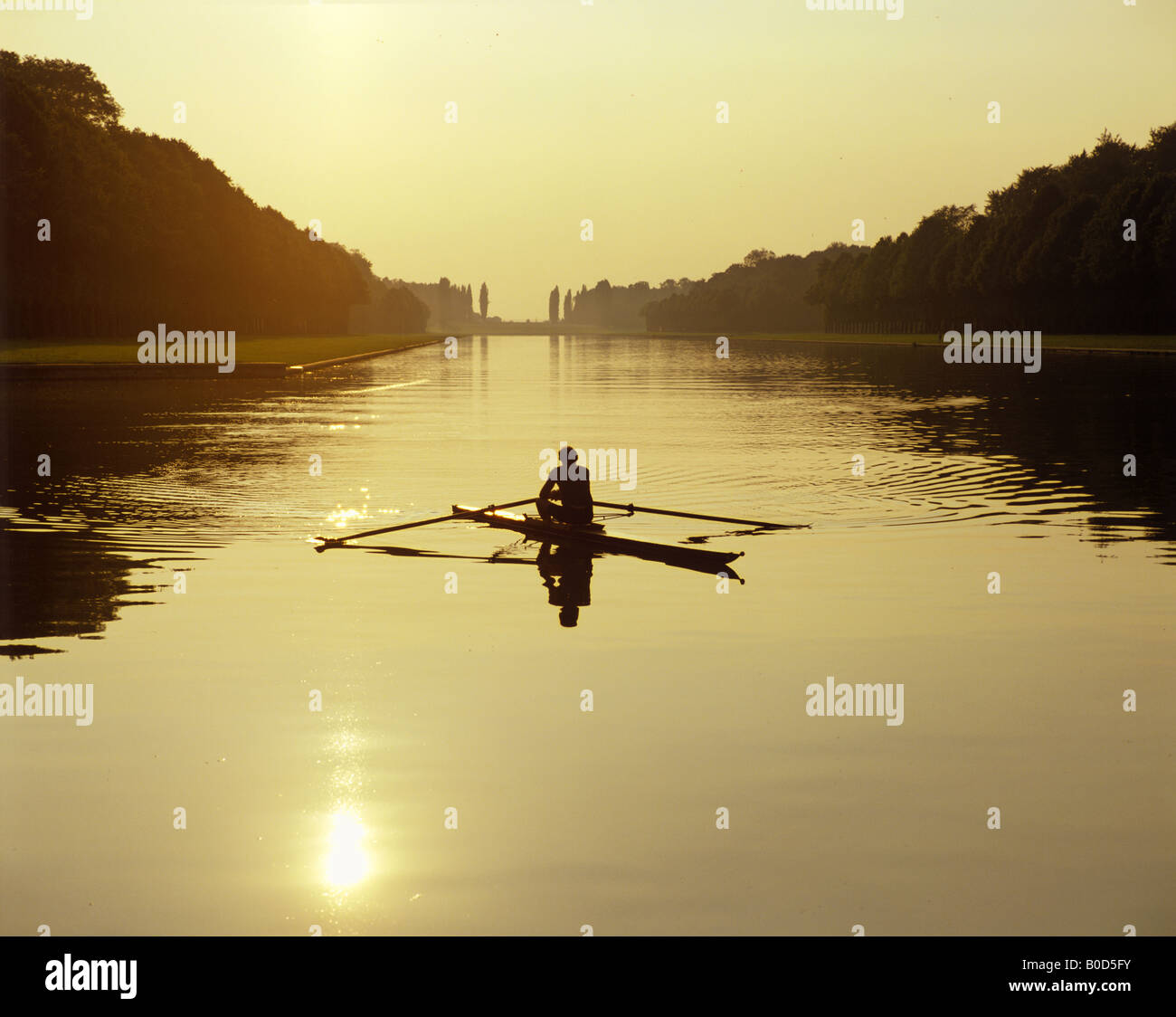 Rowing boat in sunset a pond of Versailles Palais France Stock Photo