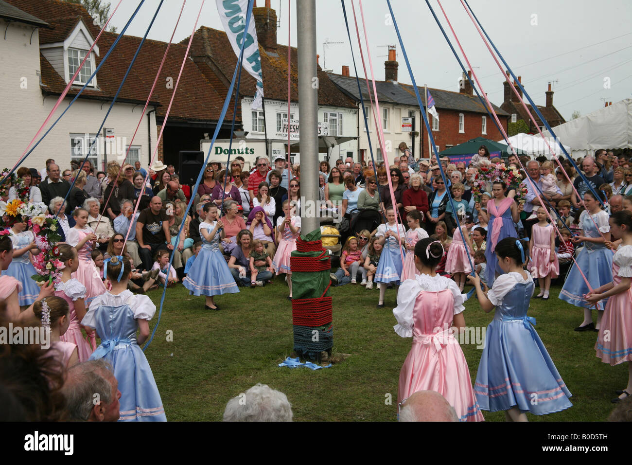 Children dancing around the Maypole at The Downton Cuckoo Fair Stock