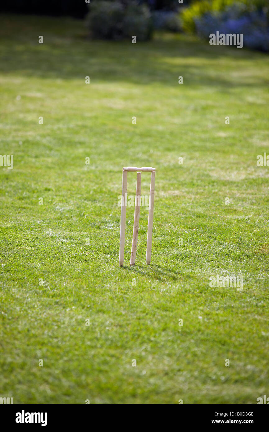 Childrens set of cricket stumps set up in a back garden Stock Photo