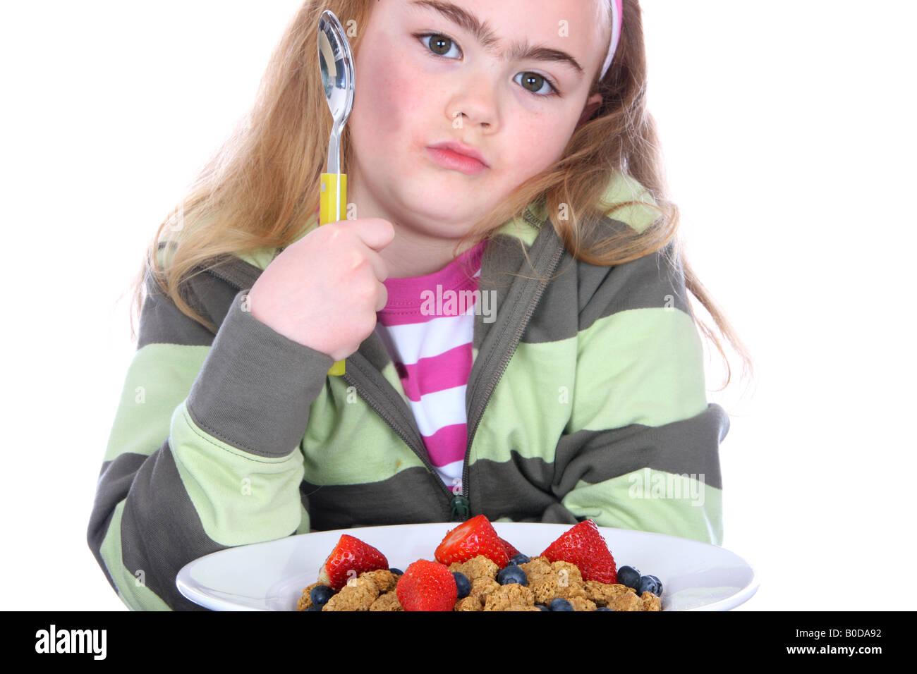 Unhappy Child with Cereal Model Released Stock Photo