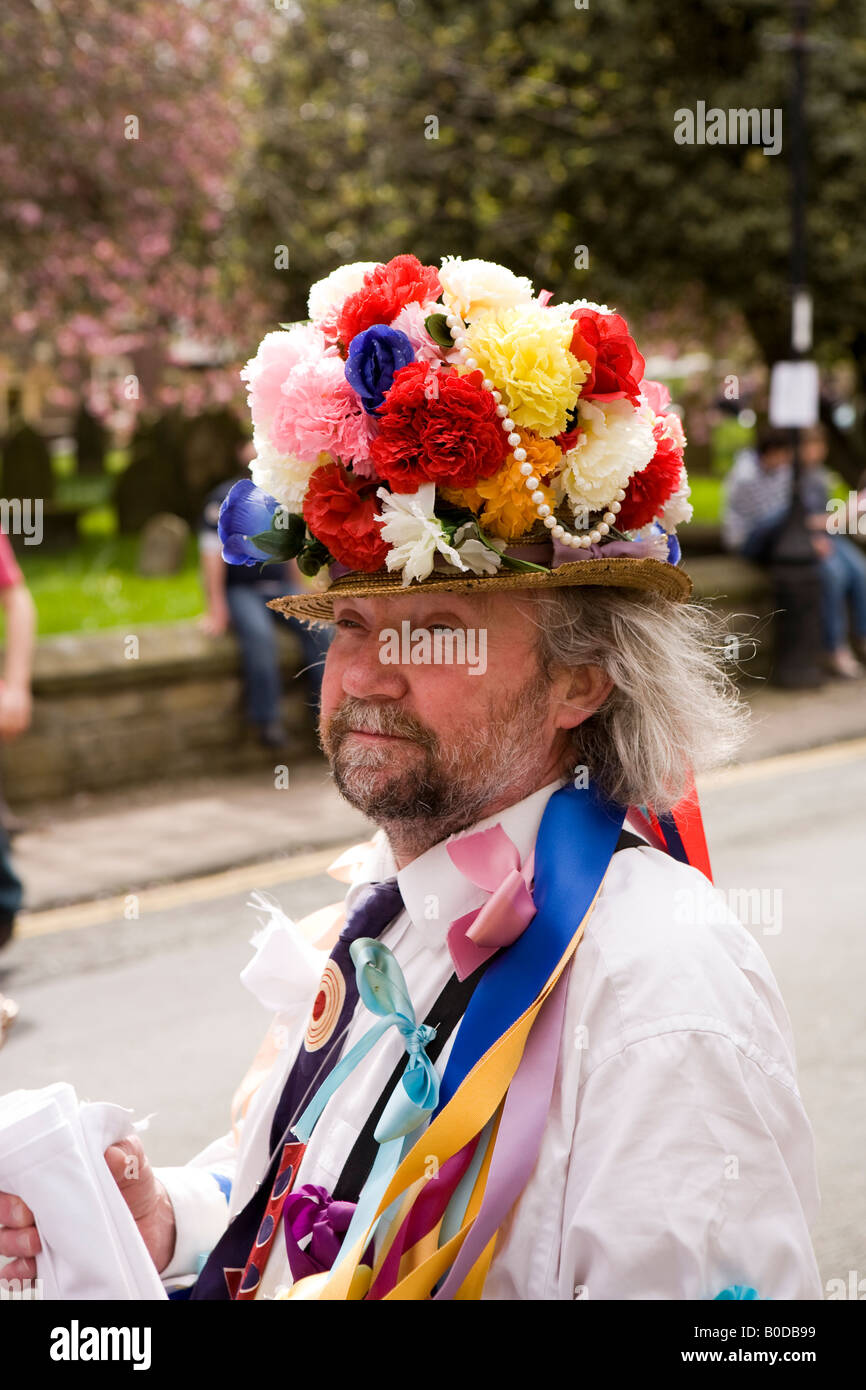 UK Cheshire Knutsford Royal May Day Morris dancer in floral hat Stock Photo