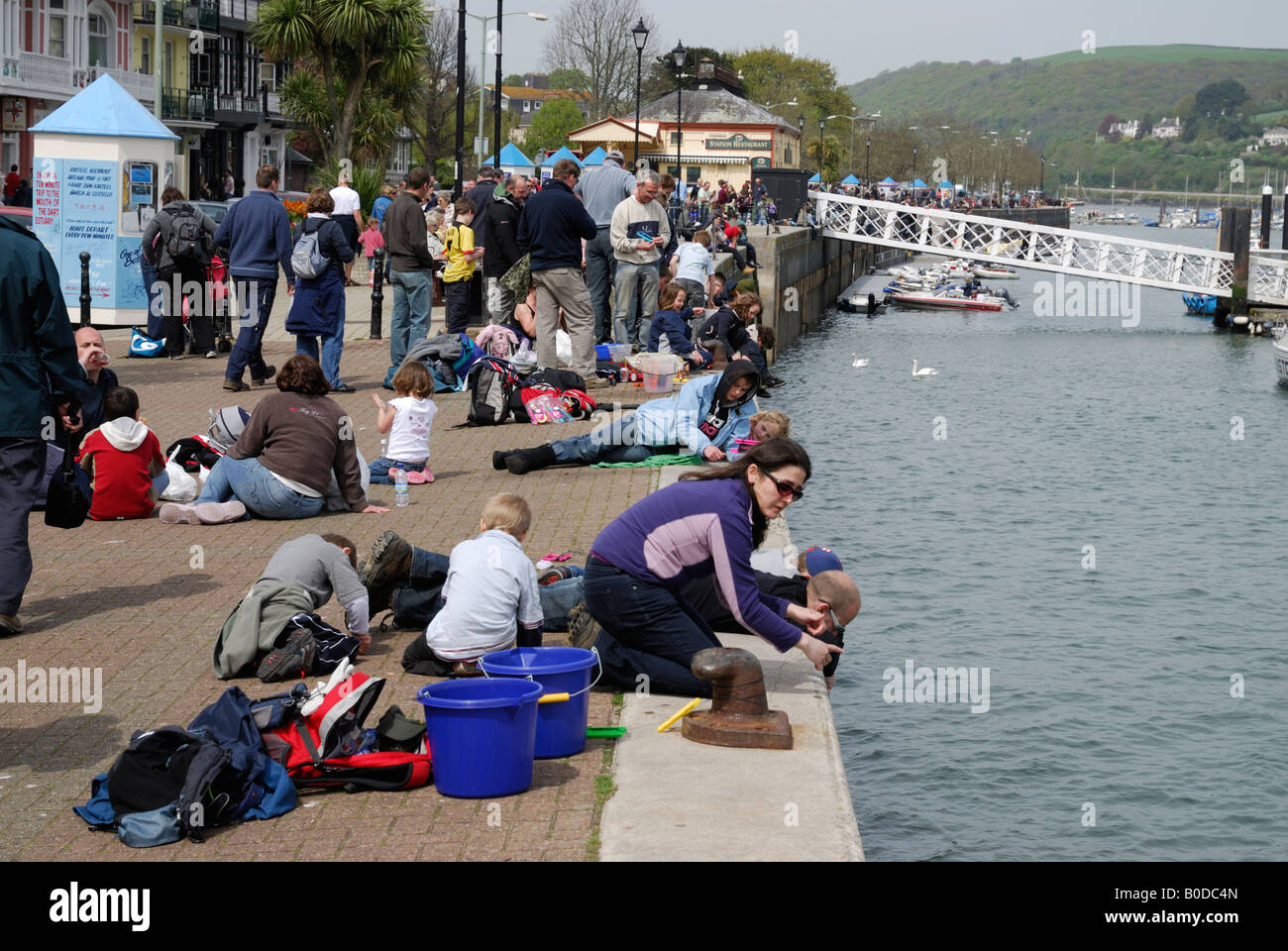 People fishing for crabs in Dartmouth, Devon, UK Stock Photo