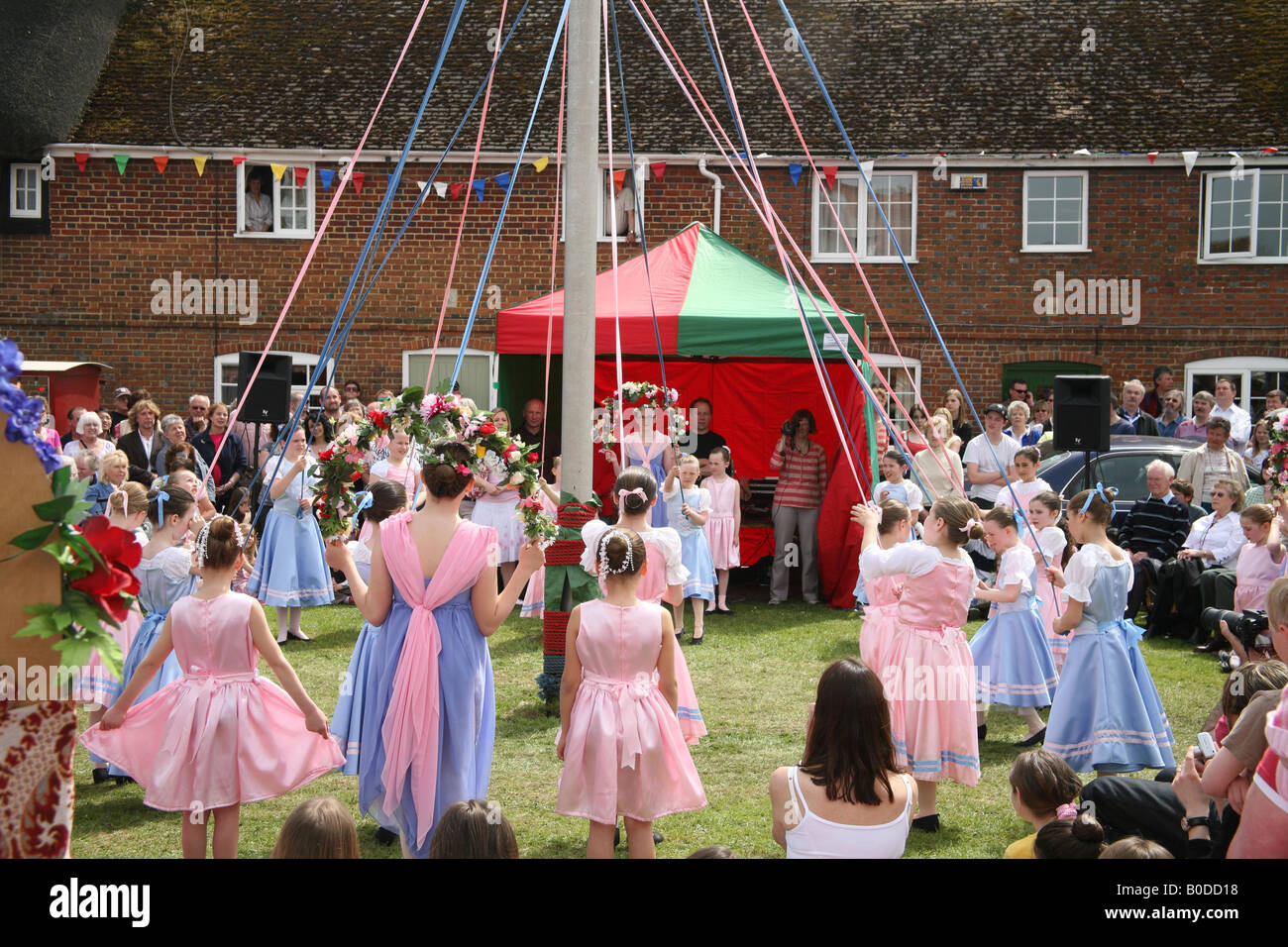 Children dancing around the Maypole at The Downton Cuckoo Fair Stock